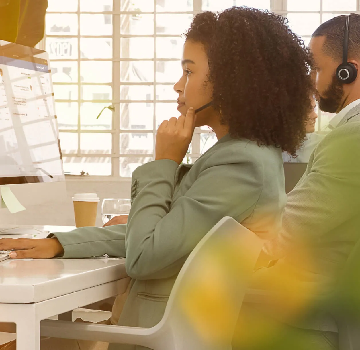 A contact center agent in conversation with a customer over the phone