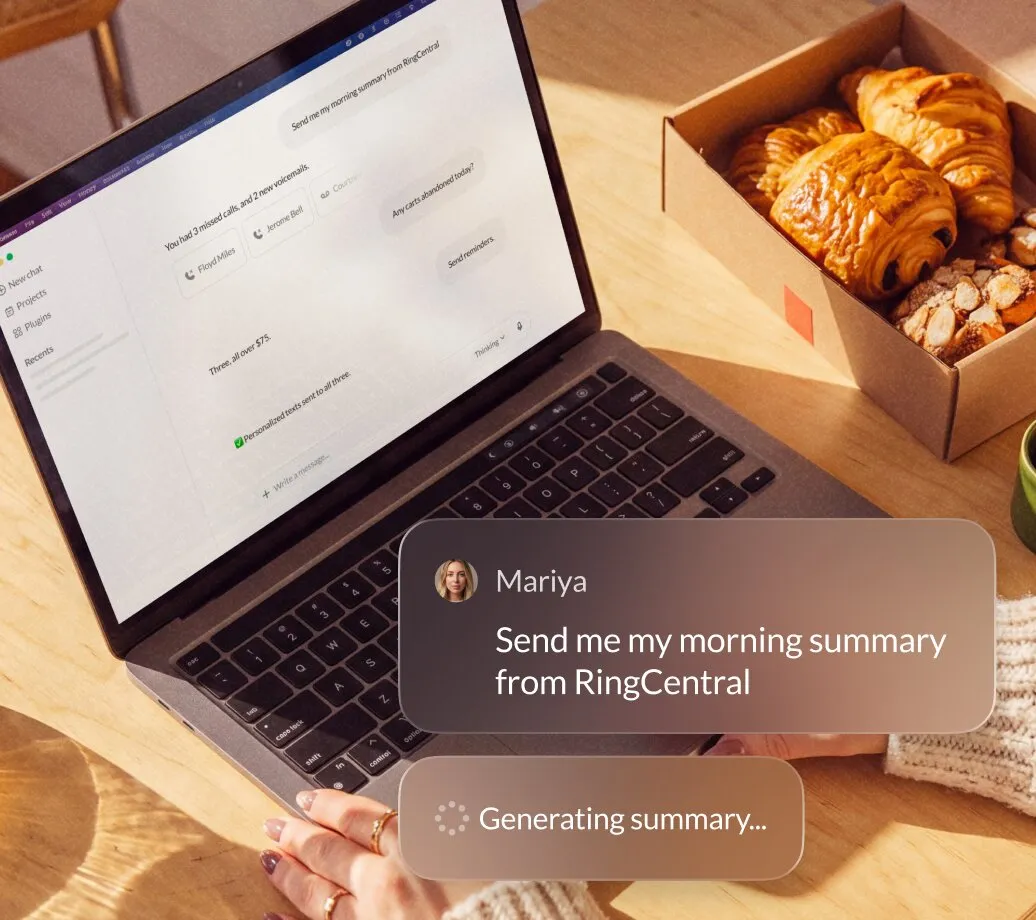 Laptop screen showing RingCentral interface with a message request for a morning summary, next to a box of pastries.