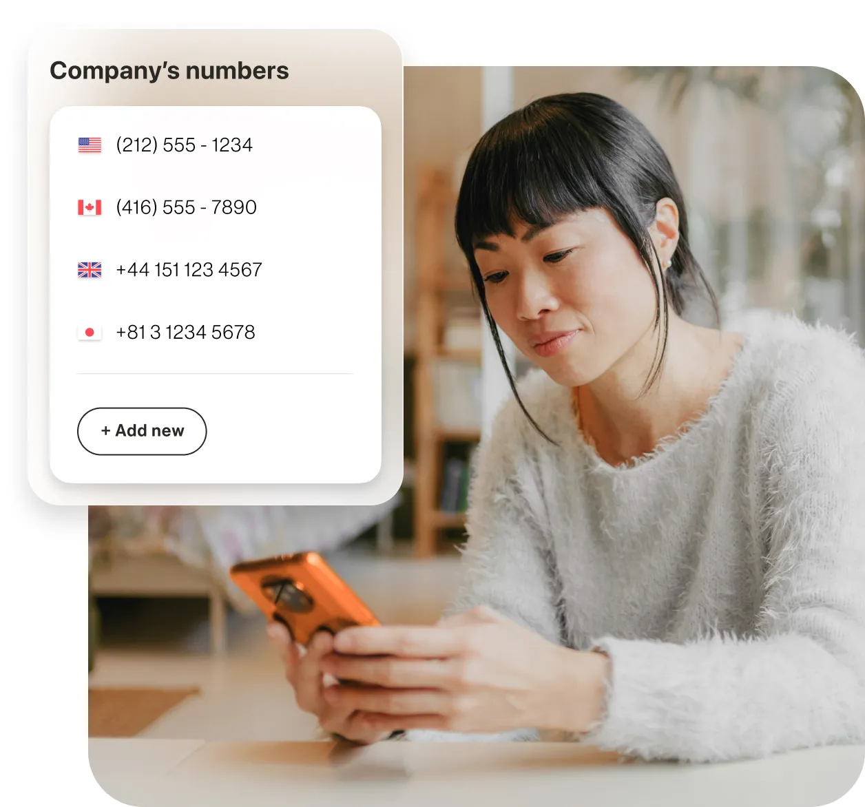 A woman looking at international company numbers on a mobile phone