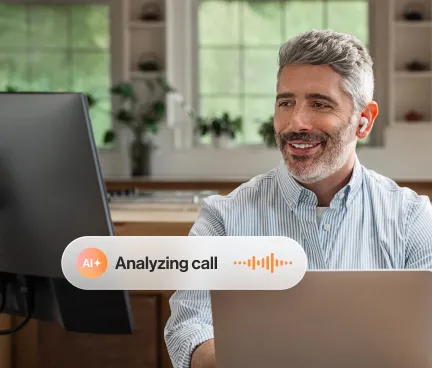 The RingCentral AI assist in use by a man working on a laptop at home