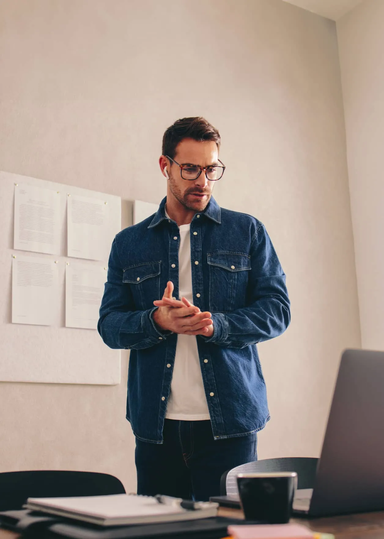 A workforce manager looking at a laptop