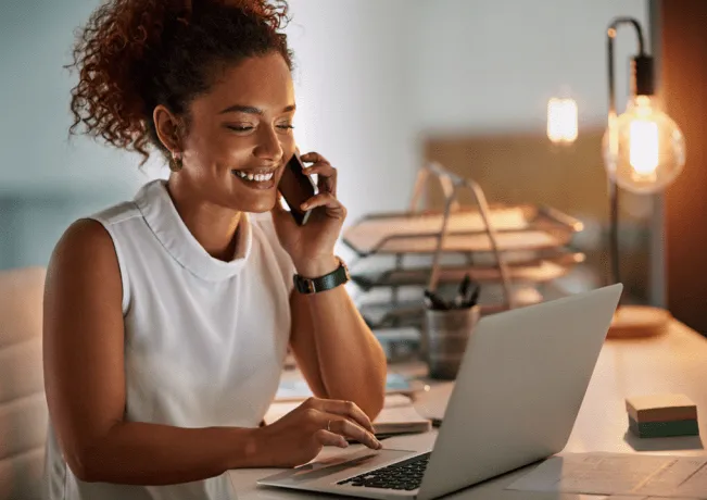 A customer calling a company for assistance while navigating the website and asking questions via live chat.
