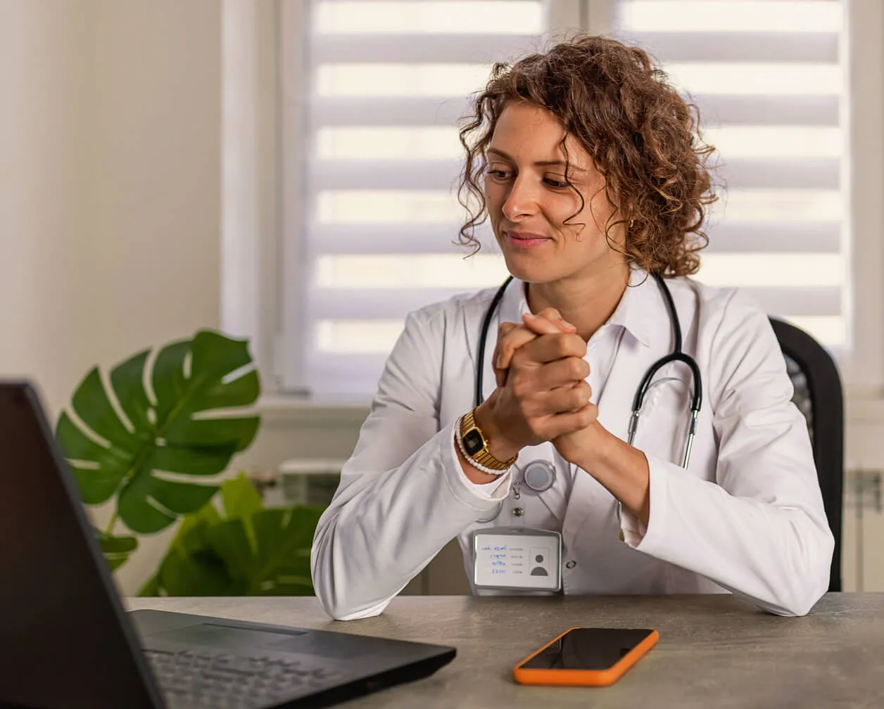 A female healthcare professional on a video meeting