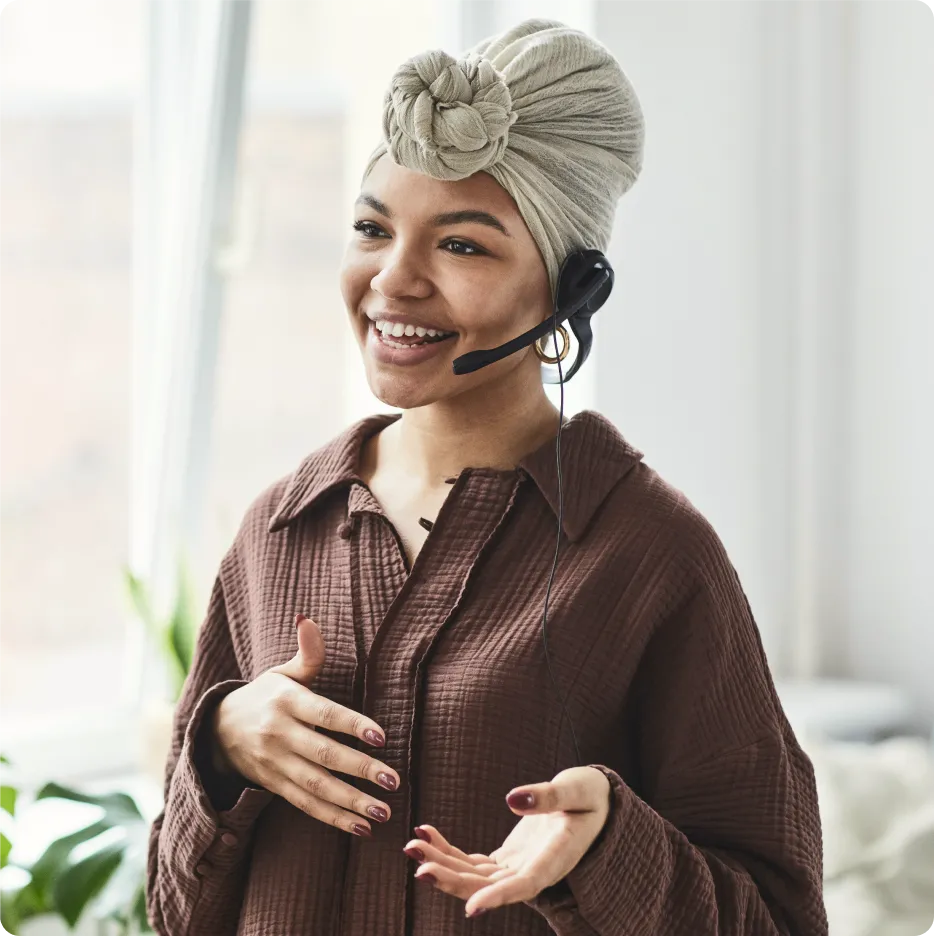 A woman on a call using a headset phone